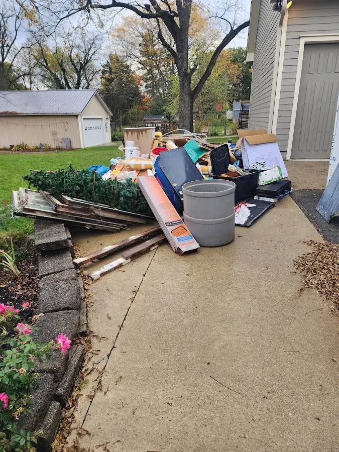 Dumpster being loaded with debris for 30 Yard Dumpster Rental in Baraboo